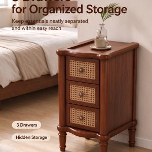 Three rattan-front drawers on a narrow solid wood end table beside a bed